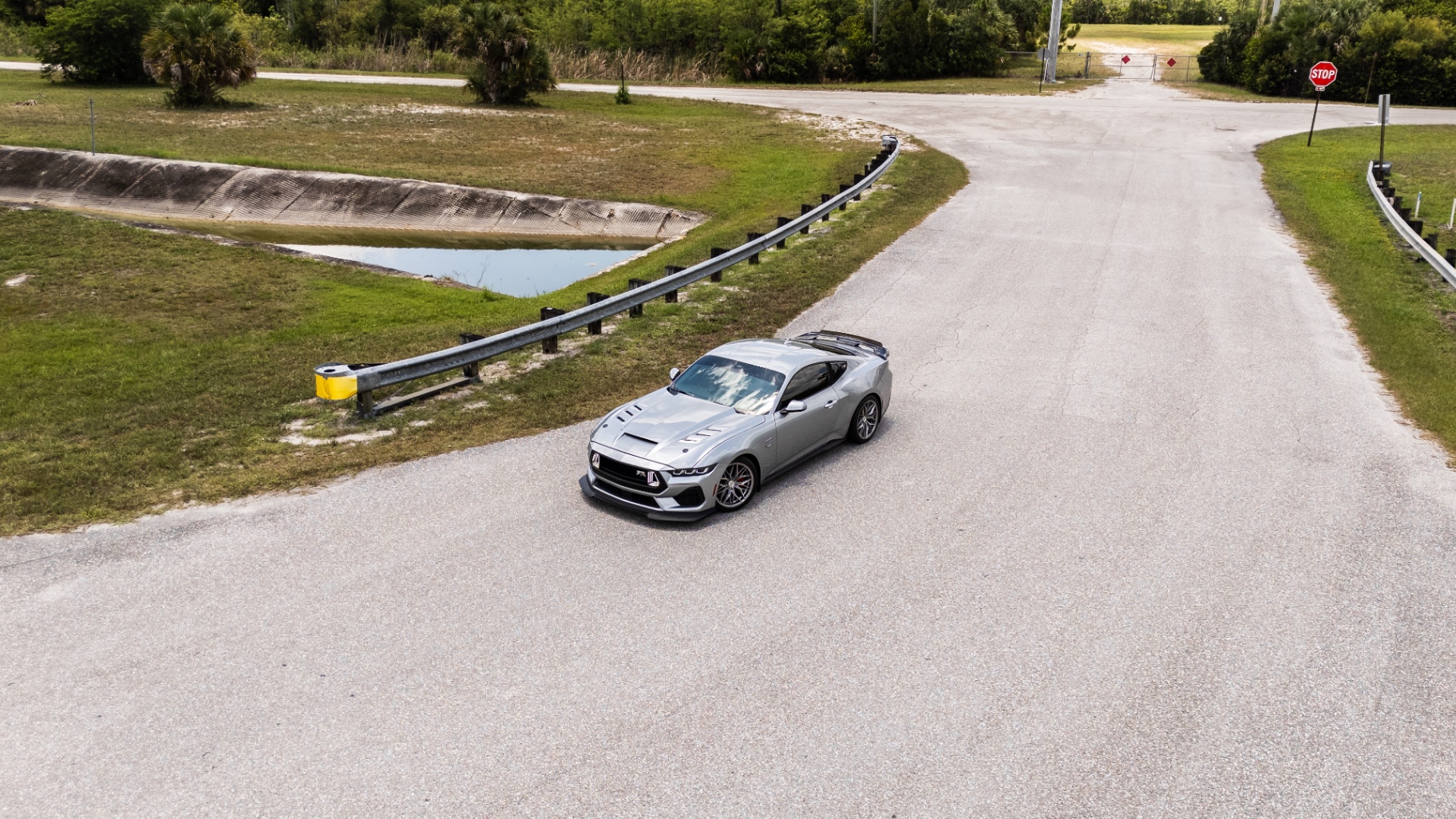 Aerial drone shot of silver Mustang RTR on Florida back road