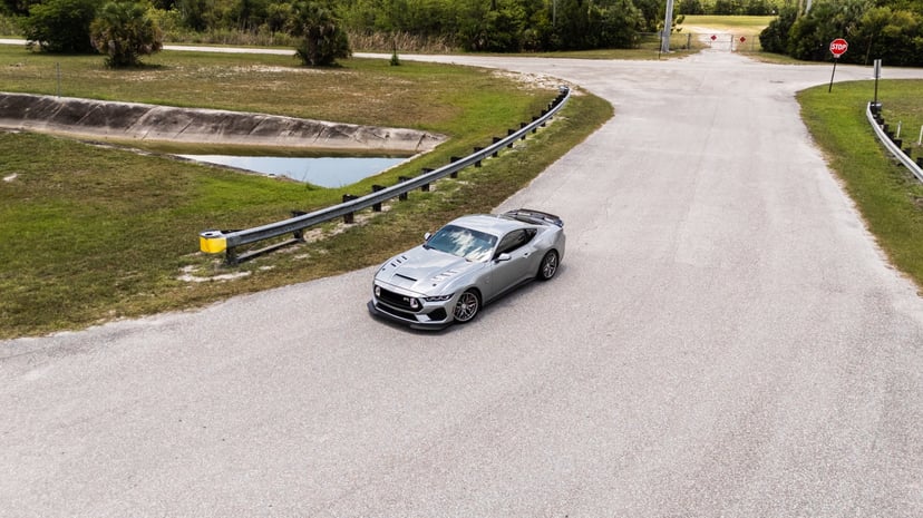 Aerial drone shot of silver Mustang RTR on a Florida back road