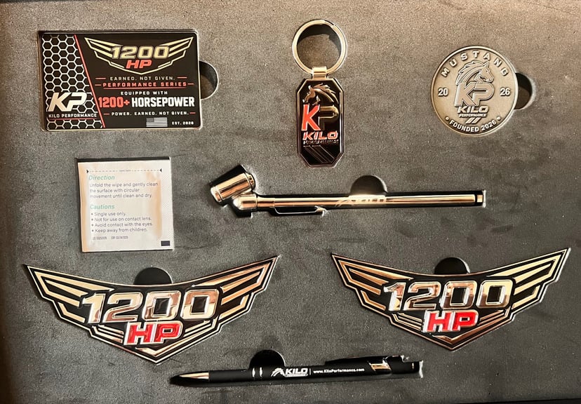 1200 HP Collector Kit — contents: two winged emblems, Kilo Performance collector card, keychain, challenge coin, tool and pen