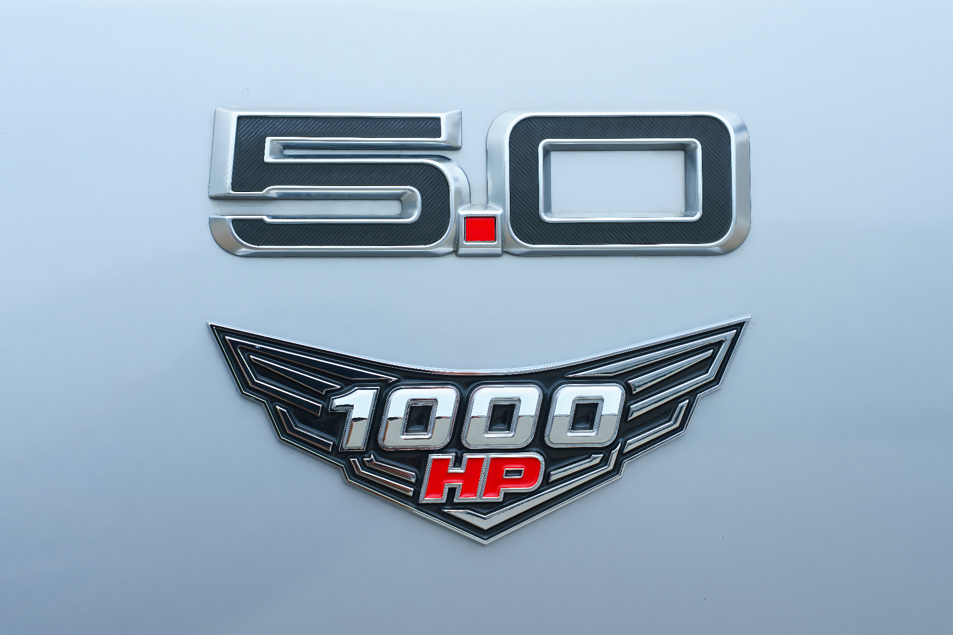 Factory 5.0 badge paired with Kilo Performance HP1000 winged emblem