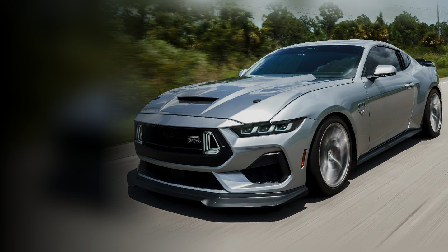Silver Ford Mustang driving with 1000 HP fender emblem — Kilo Performance
