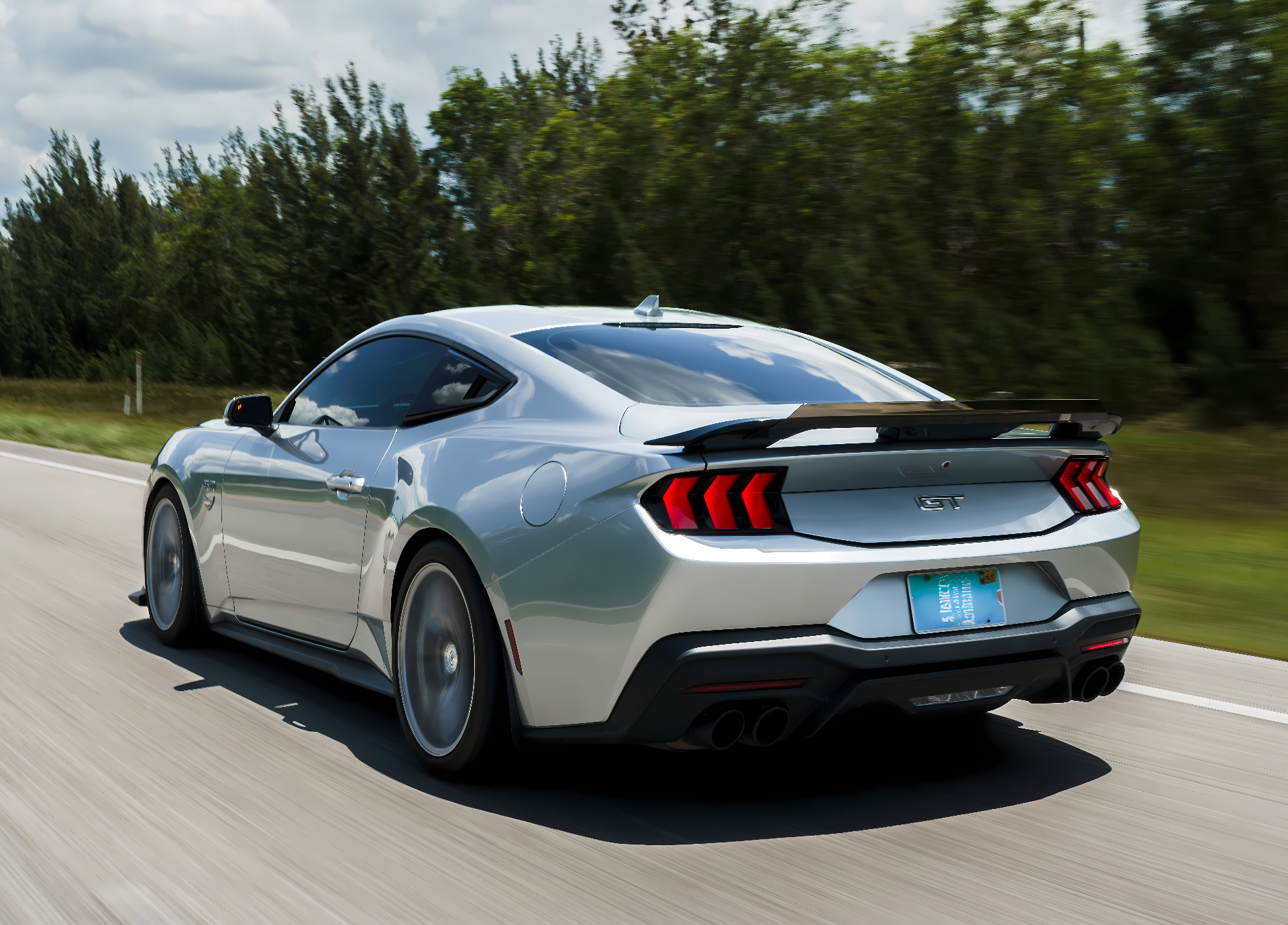 Silver S650 Mustang GT rear three-quarter in motion